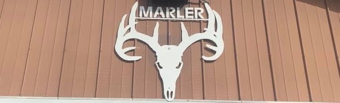 Close-up of the MARLER deer skull and antlers sign