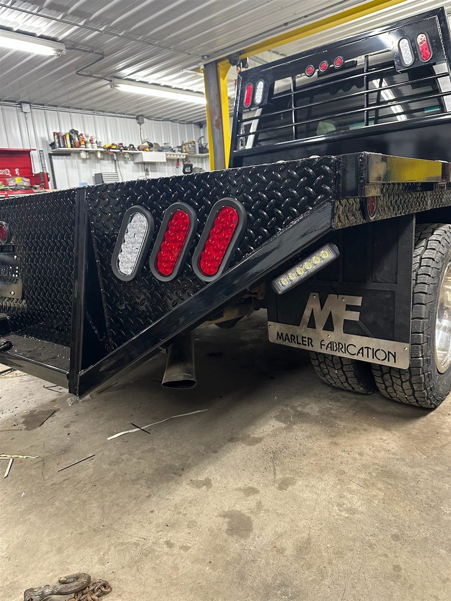 Close-up of the diamond-plate corner, LED lights and MF mud flap