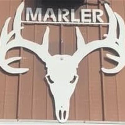 Close-up of the MARLER deer skull and antlers sign