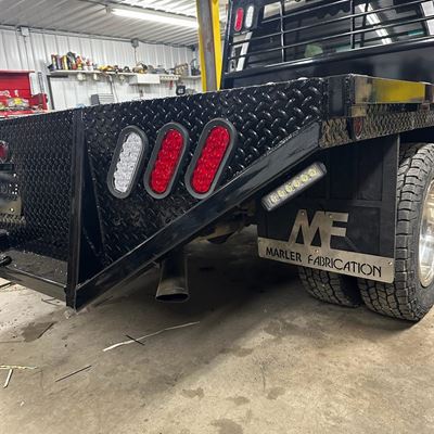 Close-up of the diamond-plate corner, LED lights and MF mud flap