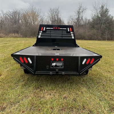 Rear of the flatbed with LED tail lights and a Marler Fabrication plate