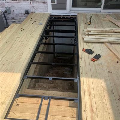 Steel hatch frame set into the deck during the build