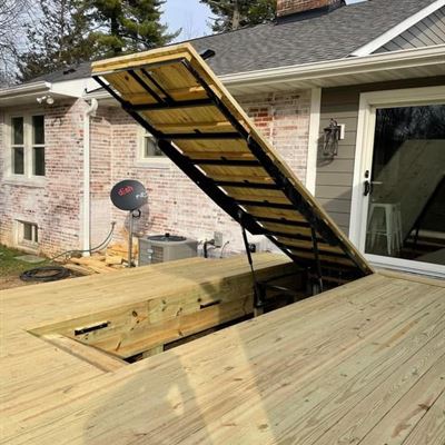Deck hatch lifted open on its steel frame