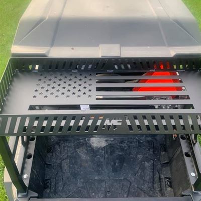 Top shelf of the cargo rack with an American flag and MF logo cut into the steel