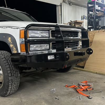 Angled view of the bumper showing the LED light, receiver hitch and shackle mounts