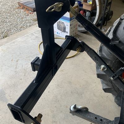 3-point hitch attached to the tractor arms