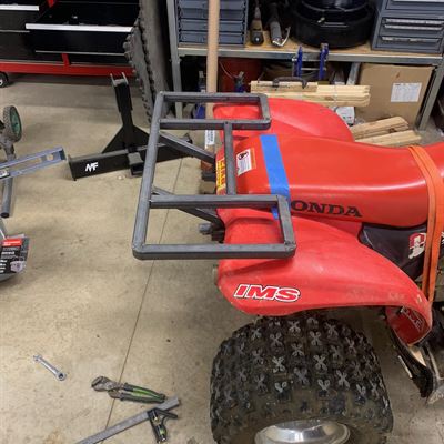 Rear ATV rack being fitted