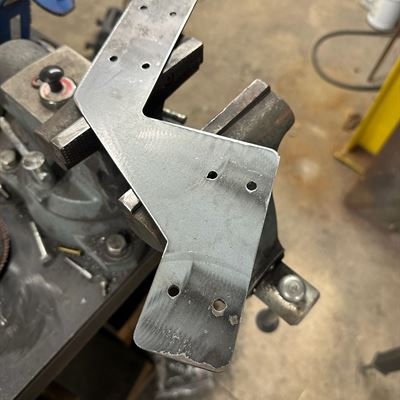 Custom steel bracket in the vise