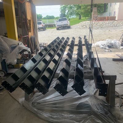 Steel beams with brackets ready for a pergola