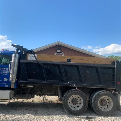 Dump truck with a custom tarp system