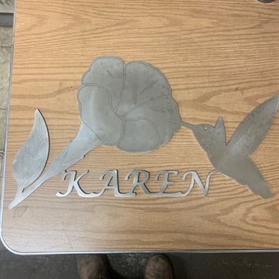 CNC plasma-cut flower and name sign