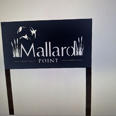 Mallard Point sign with ducks and cattails