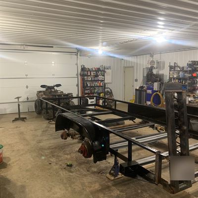 Trailer frame with axles and ramp gate