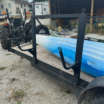 Custom kayak rack mounted on a trailer